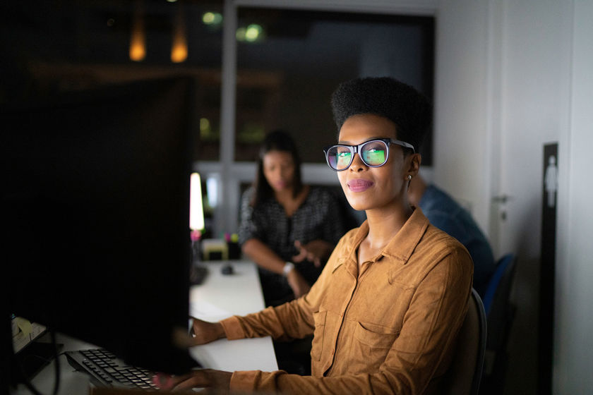 Person Working At Computer In Dark Office Copy 