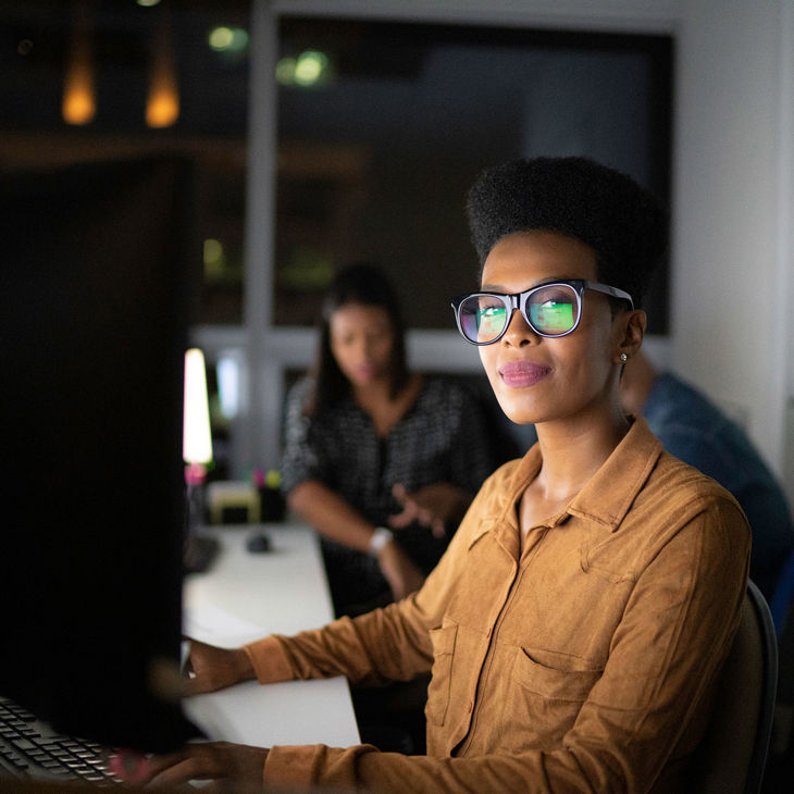 Person Working At Computer In Dark Office Copy 