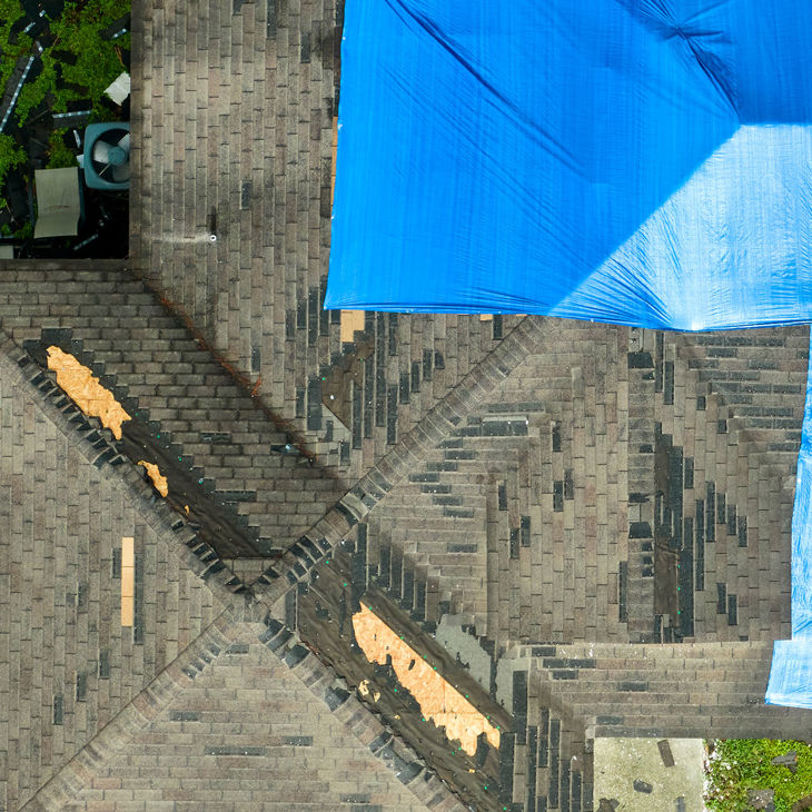 Overhead View Of Roof Needing Repair 