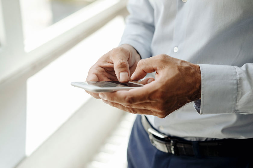 Person Typing On Mobile Phone 