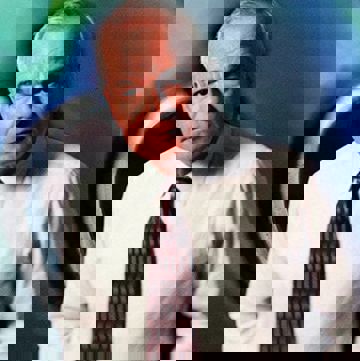 Photo illustration of ISO CEO Fred Marcon in 1996 over a colorful background