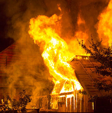 Photo of a house on fire