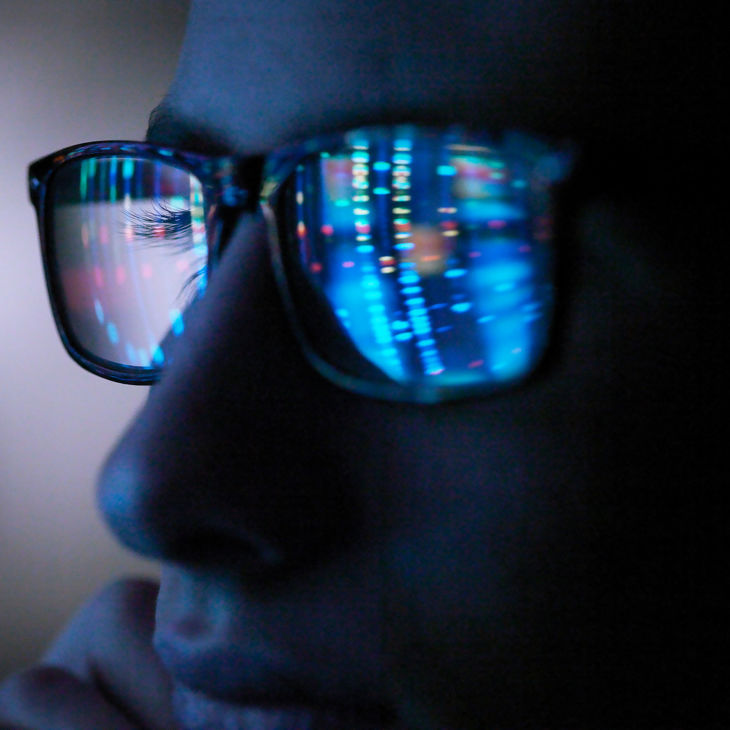 Close Up Of Glasses With Data Reflection 