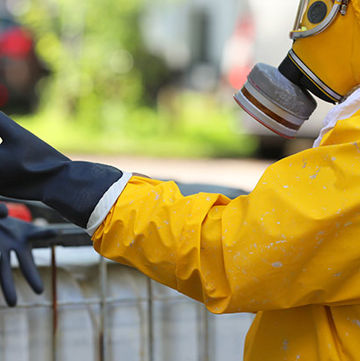 Photo of person in heavy hazmat gear