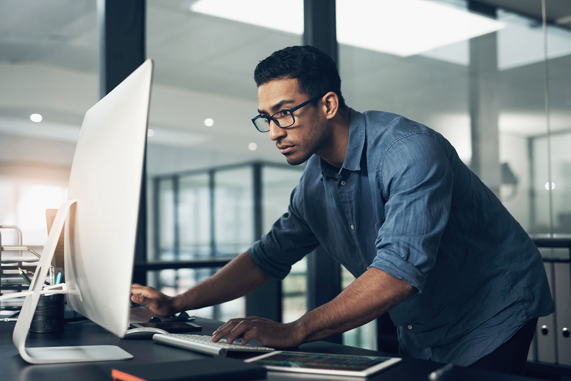 Person Leaning Over Desktop Screen 