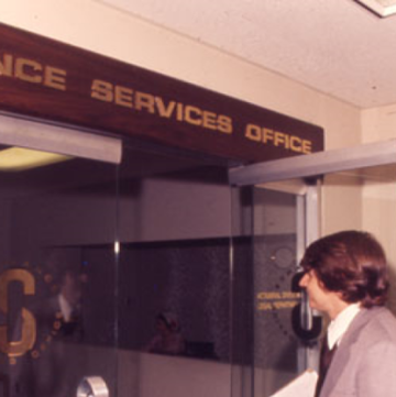 Man entering Insurance Services Office in 1971