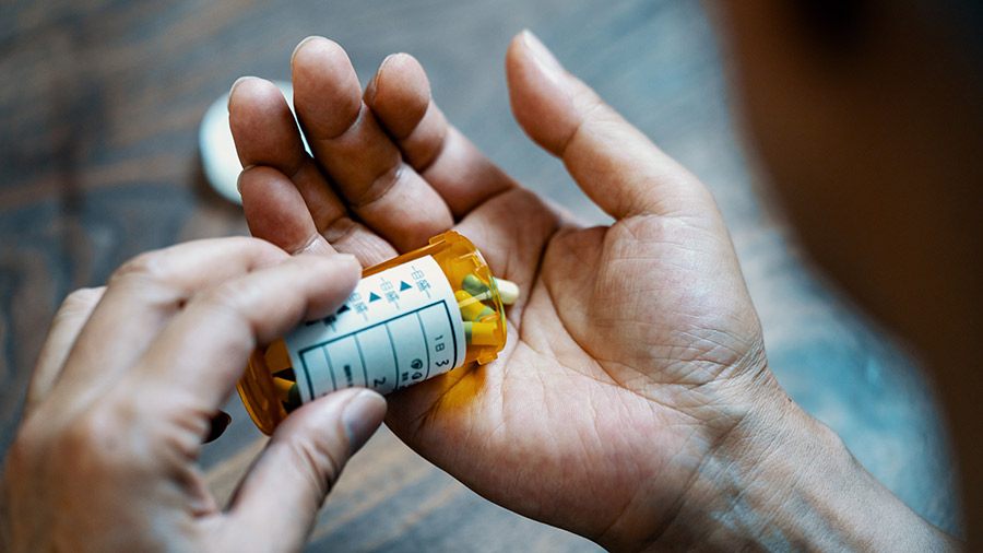 hand-holding-pill-bottle