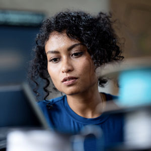 Woman At Desk Viewing Computer Screen 