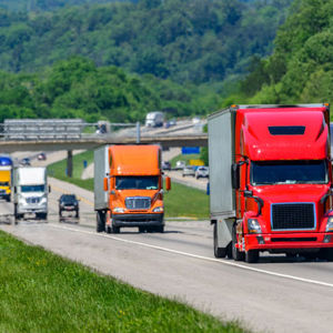 Many Semi Trucks Traveling Down Highway 