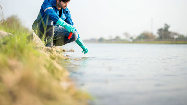 Scientist Testing Water Sample 