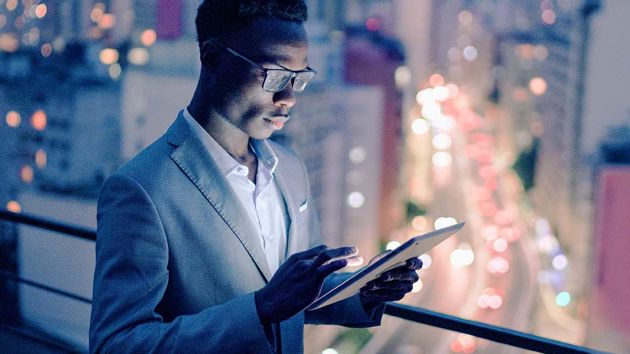 Man On Balcony Holding Ipad3 