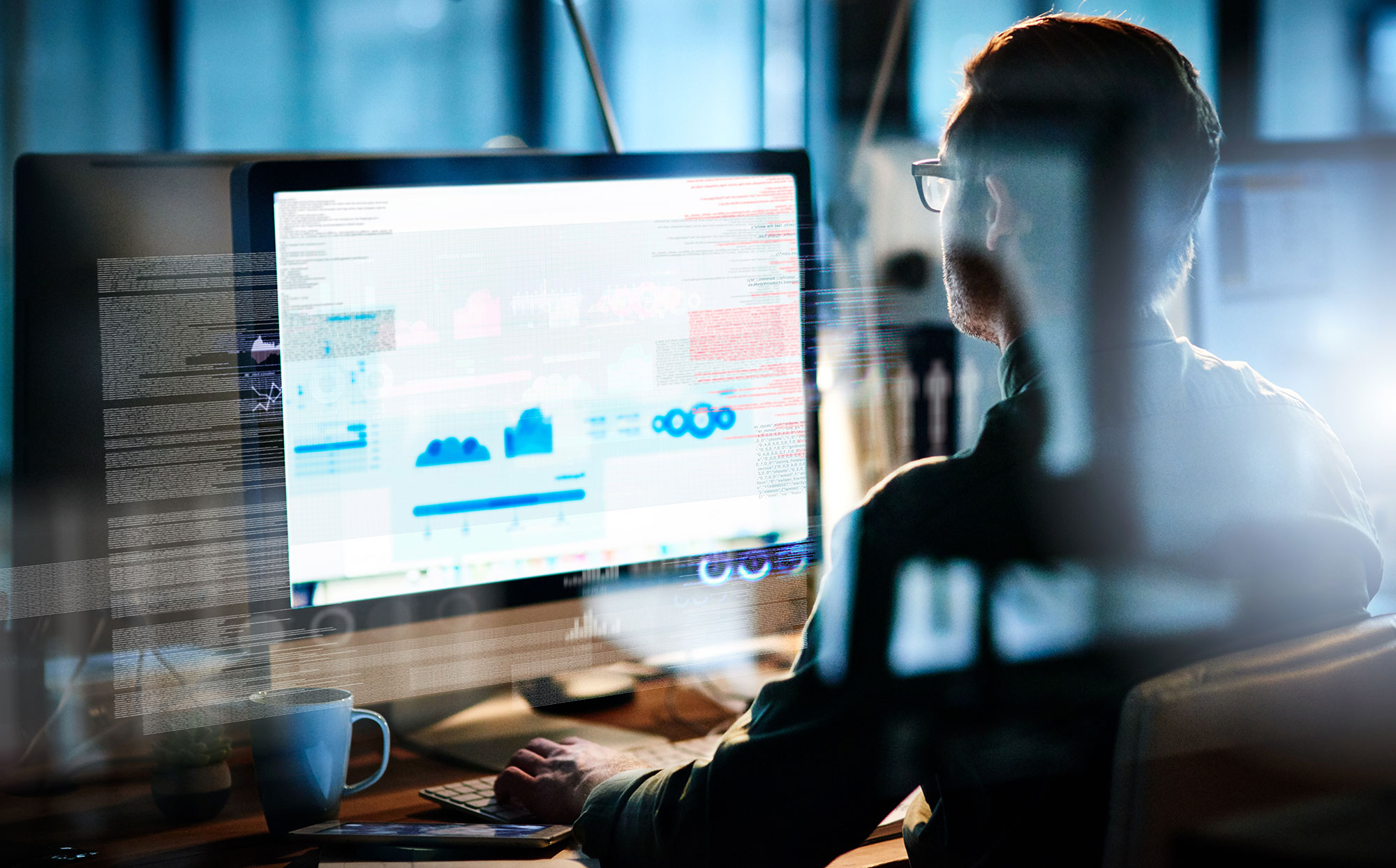 Man Reviewing Data On Computer 
