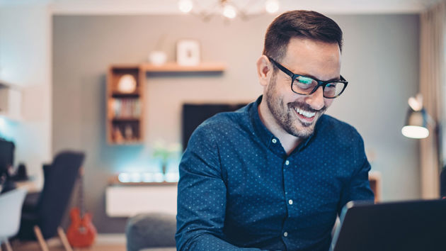 Happy Person At Home Using Laptop 