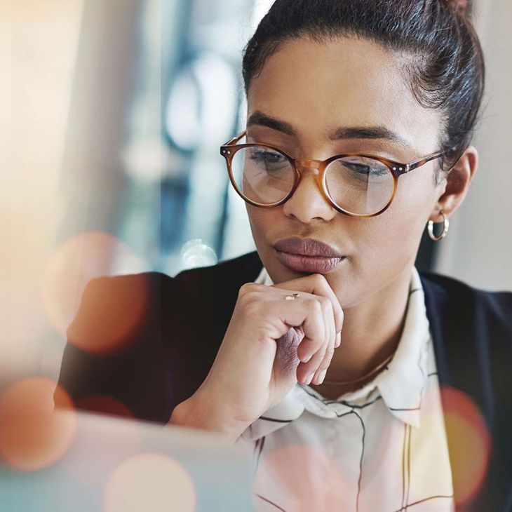 Woman Reviewing Data On Screen 