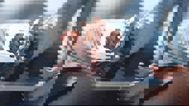 Person Tapping On Tablet 