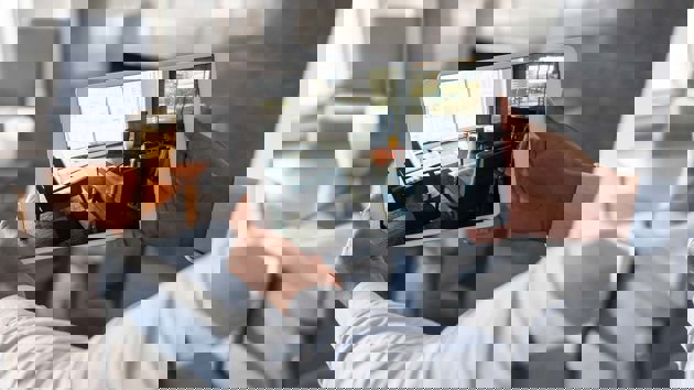 Man With Tablet Taking A Photo Of Furniture 