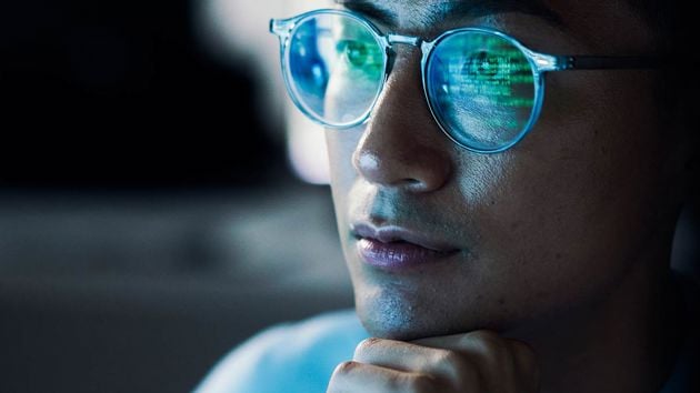 Professional Reviewing Data On Screen 