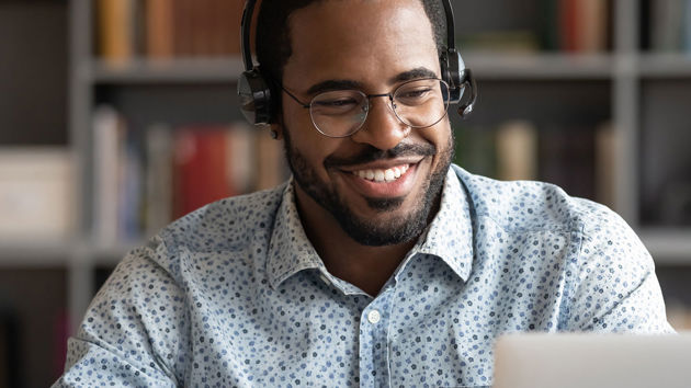 Happy Person Working Wearing Headphones 