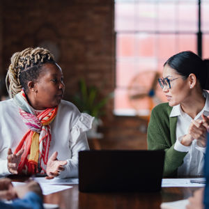 Coworkers In Discusssion At Table 