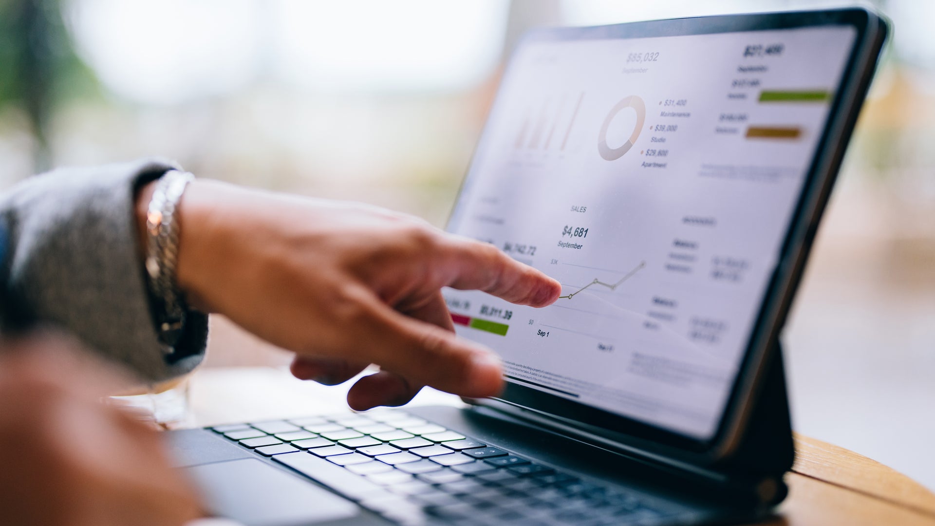 finger pointing to tablet