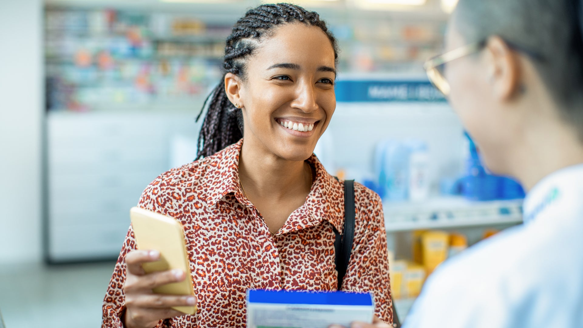 woman talking to pharmacist