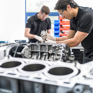 Mechanics Working On Engines 